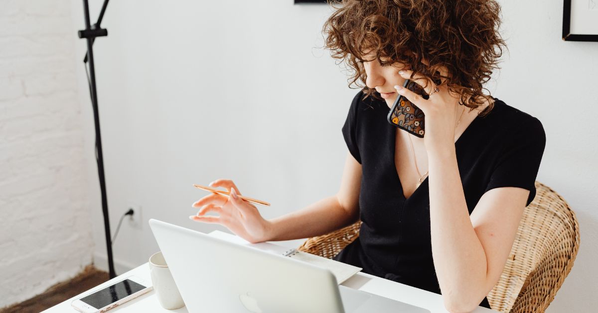 Women talking on phone and on computer