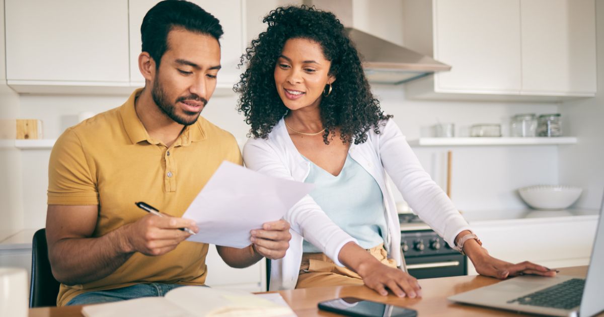 man and women looking at paperwork